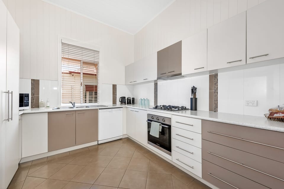 Large functional kitchen with appliances. 
