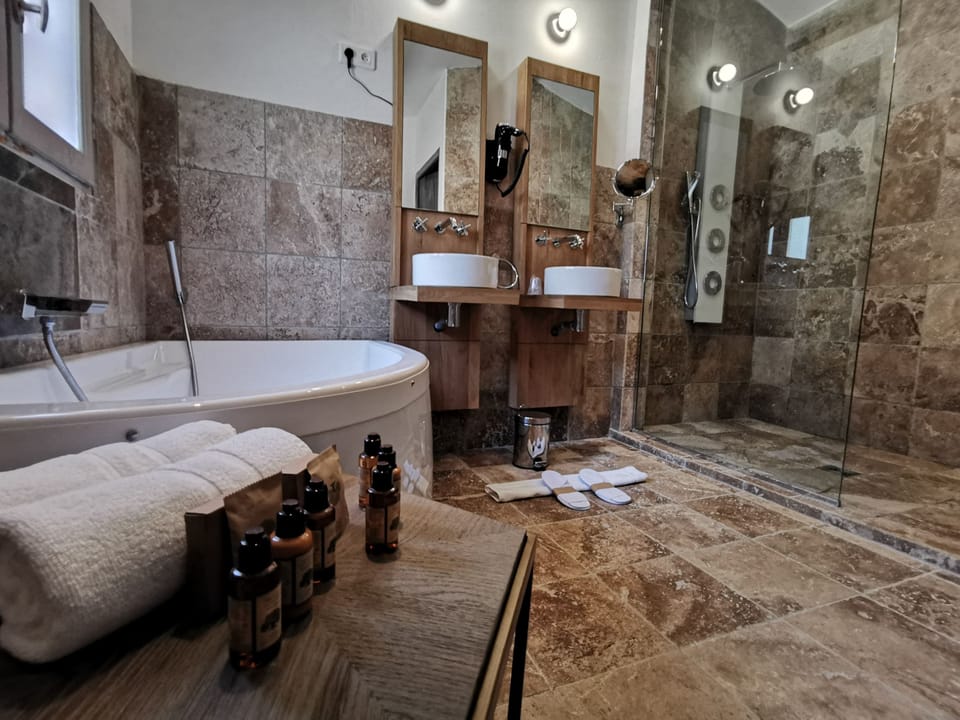 Deluxe Suite, Terrace, Poolside | Bathroom | Free toiletries, hair dryer, towels