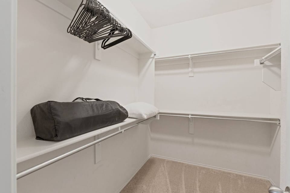 A portable pack and play for our younger guests is clean and ready to be used for mid-day napping.