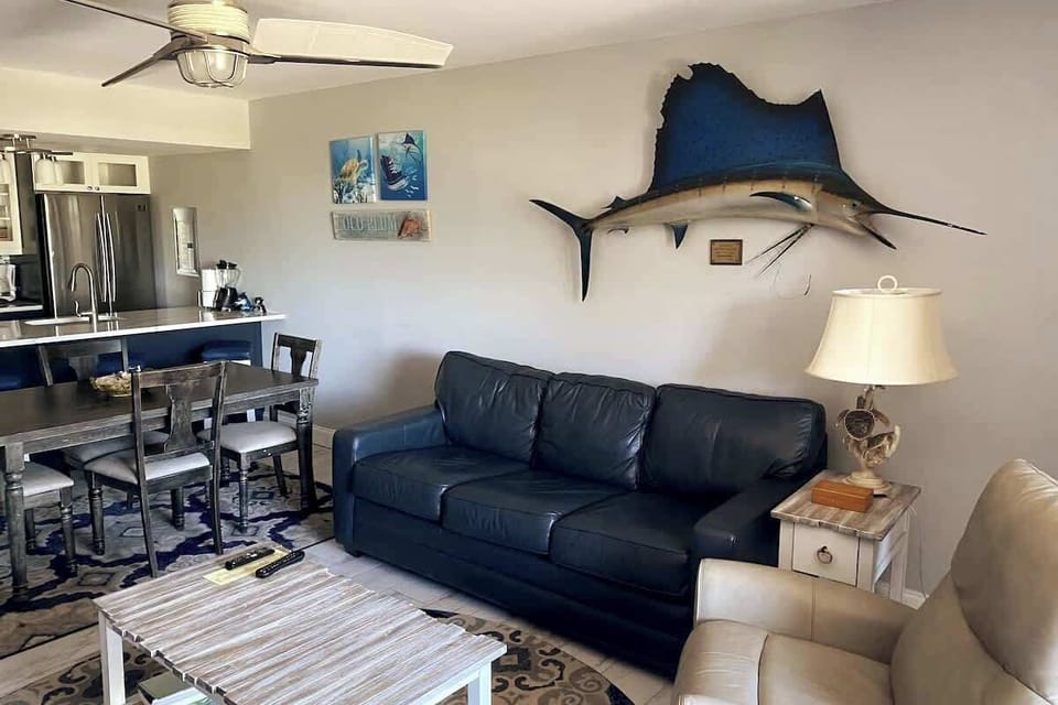 Enjoy the cozy, open living spaces adorned with angler decor.