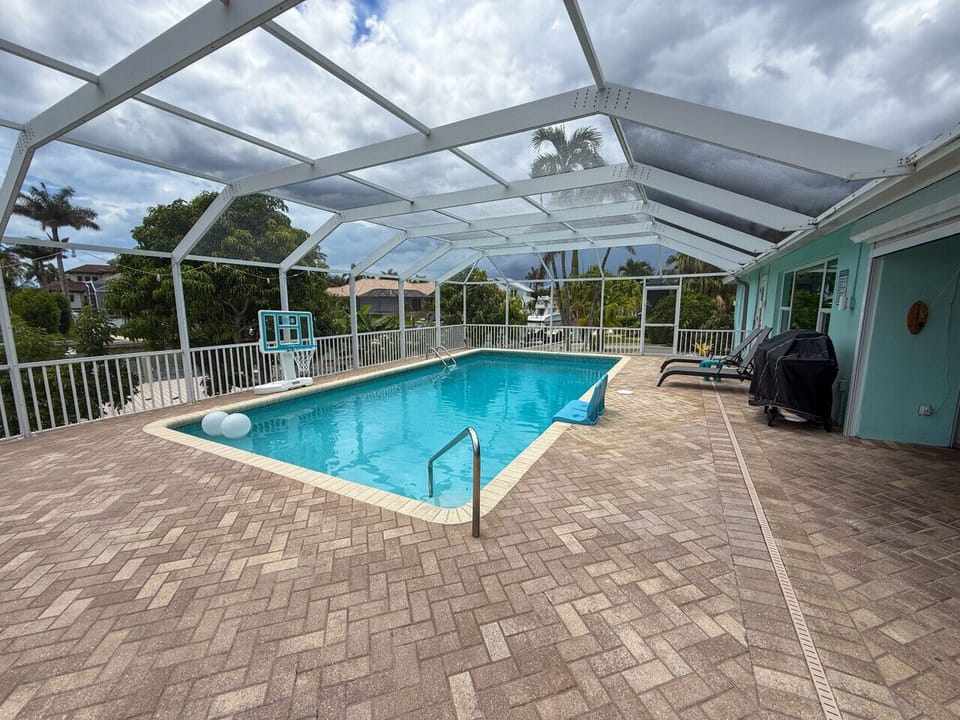 Large heated to 88 F saltwater pool with basketball hoop and sit on the edge seats