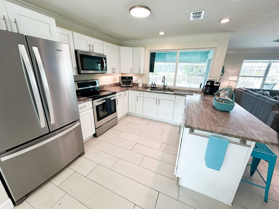 Fully stocked kitchen with filtered water inside the fridge door