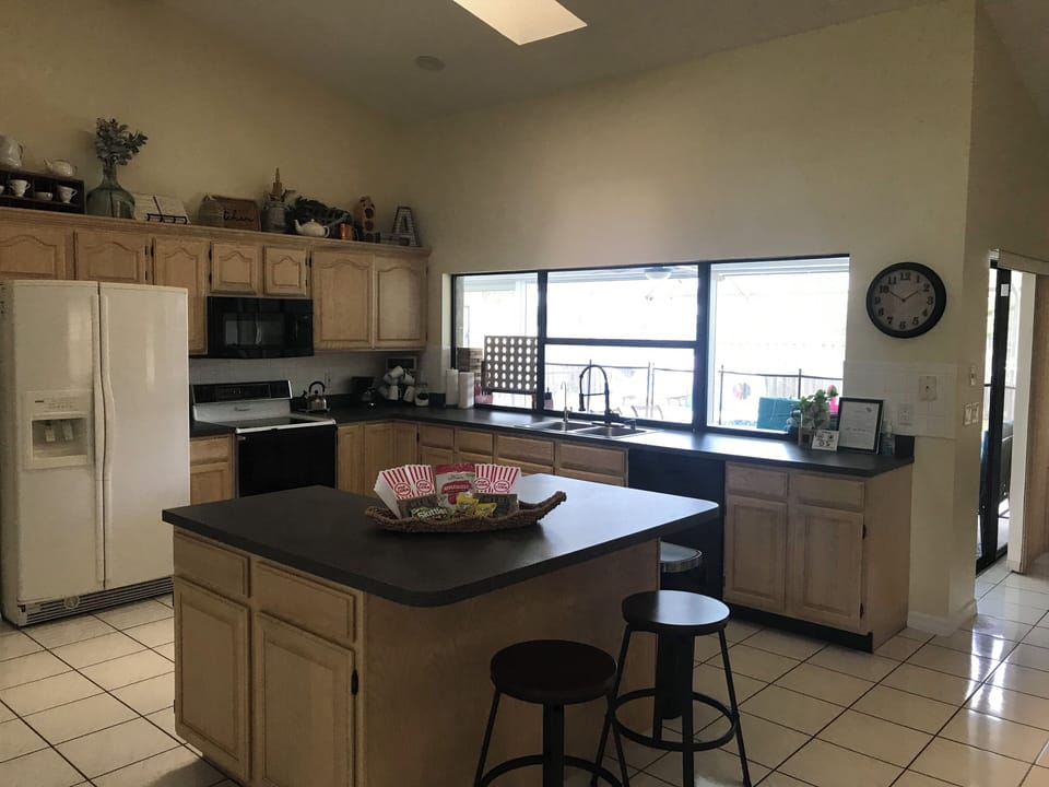 Open layout kitchen looking into the pool.