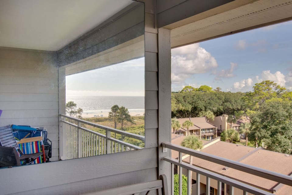 Mirror with glider below on left side of balcony