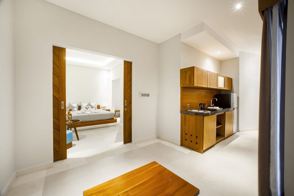 Family Suite, 2 Bedrooms | Private kitchenette | Mini-fridge, electric kettle, highchair, eco-friendly cleaning products