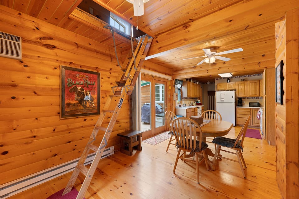 Dinning area with loft stairs down 