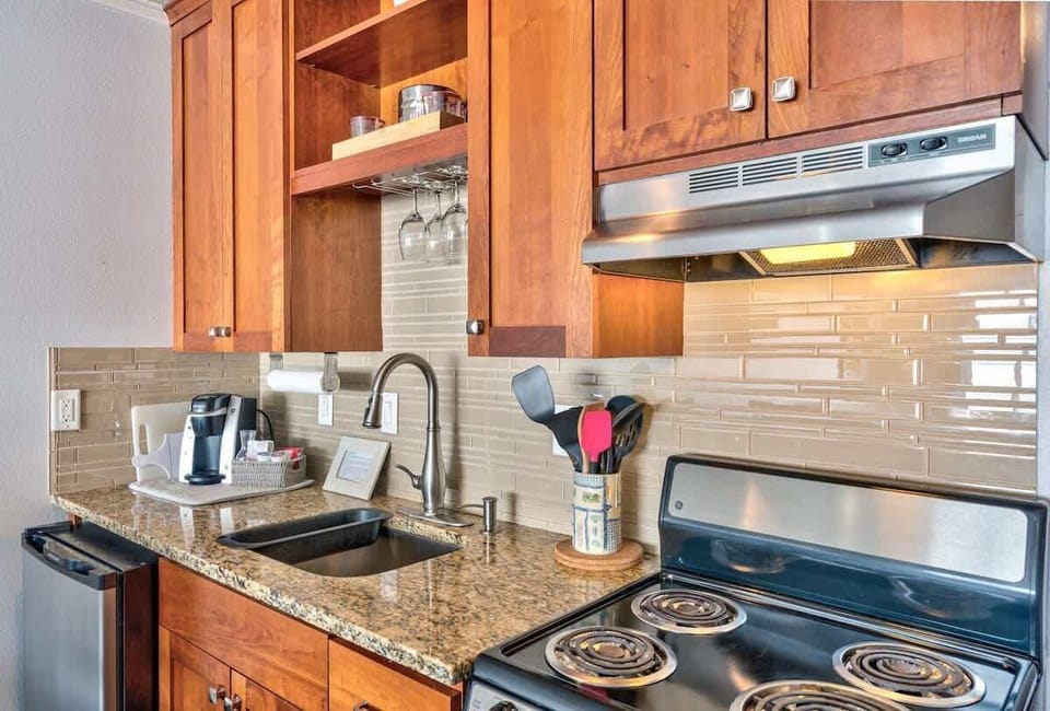 The full kitchen includes a stove, oven, and fridge