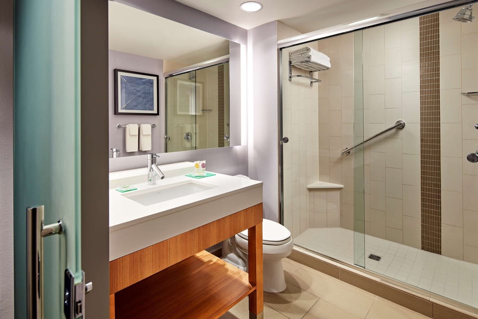 Designer toiletries, hair dryer, towels, soap