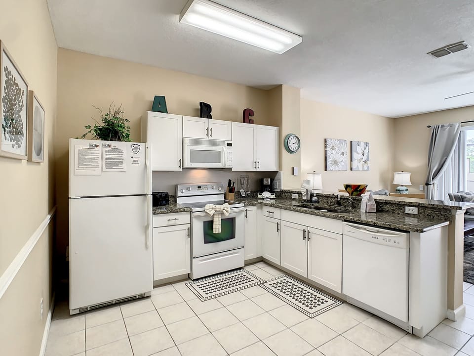 Fully equipped kitchen with ample space and modern conveniences for home-cooked meals.