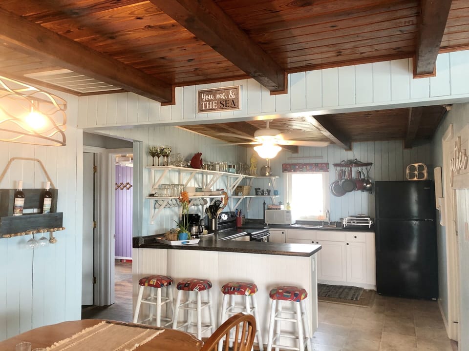   The kitchen with a condiments and spices included.
