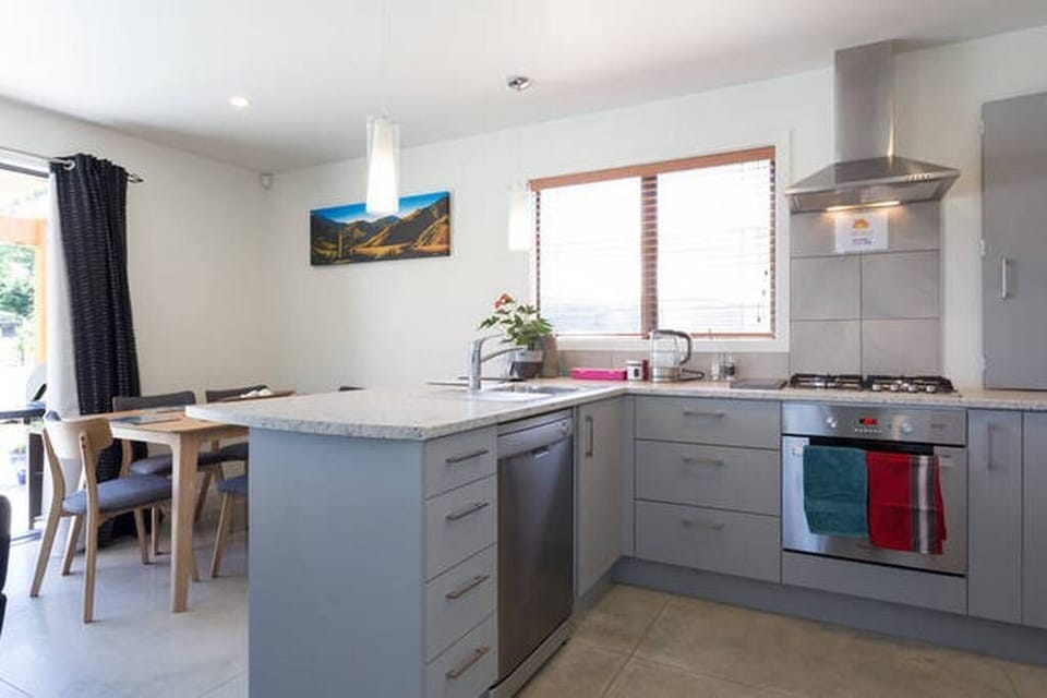 Dining/kitchen with dishwasher, oven, gas hob, fridge, cutlery/crockery...