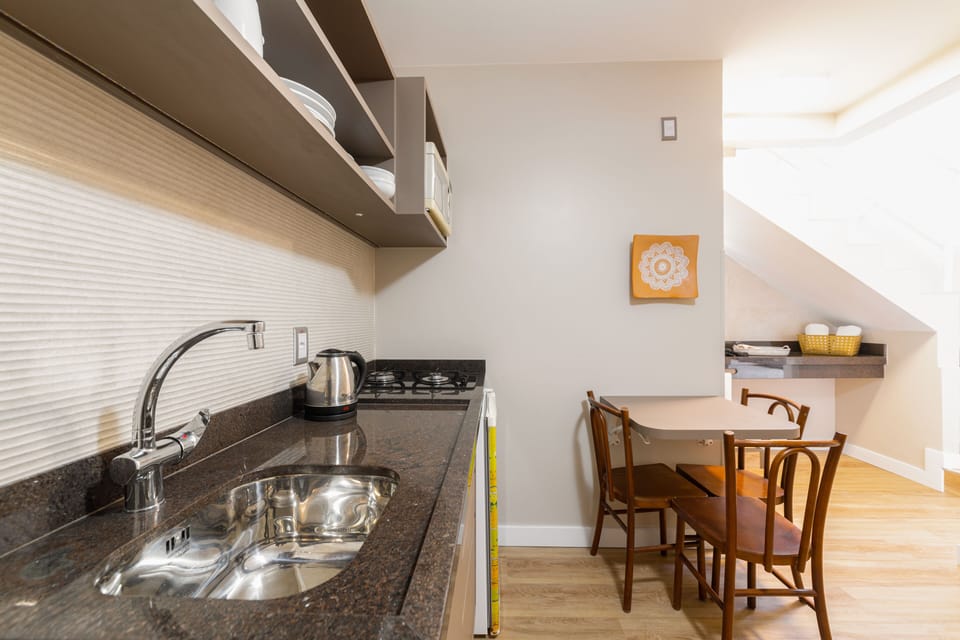 Deluxe Duplex | Private kitchen | Microwave, electric kettle