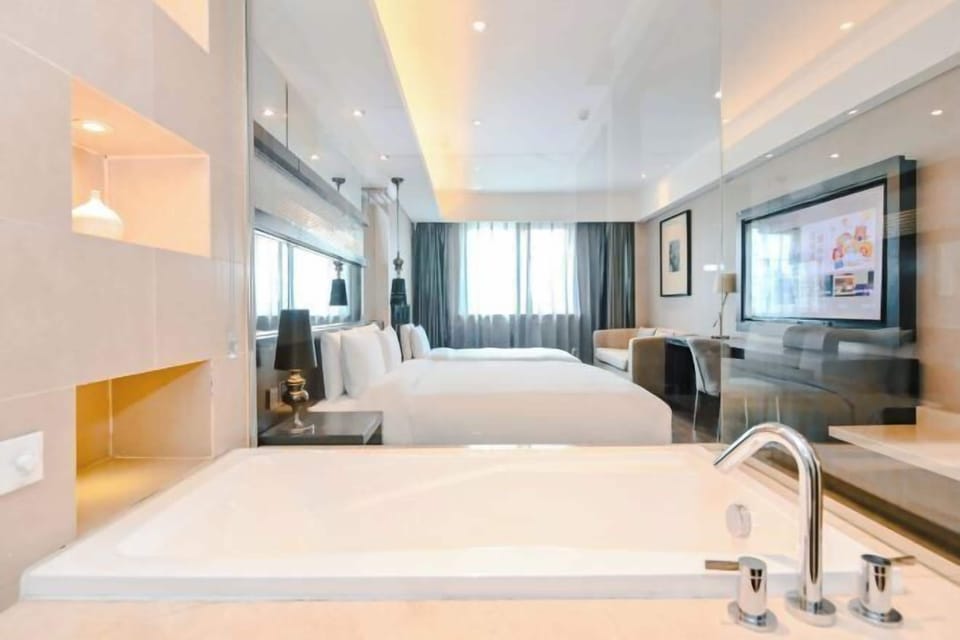 Family Twin Room | Down comforters, free minibar, desk, laptop workspace