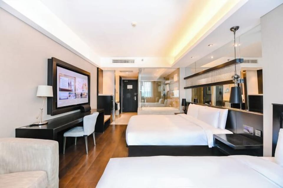 Family Twin Room | Down comforters, free minibar, desk, laptop workspace