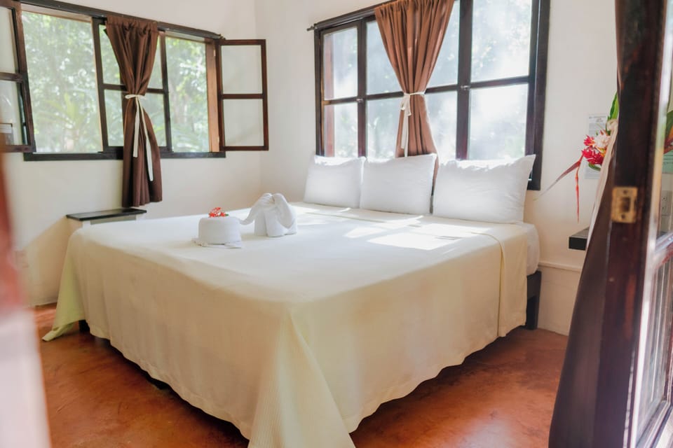 Economy Room, 1 Queen Bed, Private Bathroom | Iron/ironing board (on request), WiFi (free), bed sheets