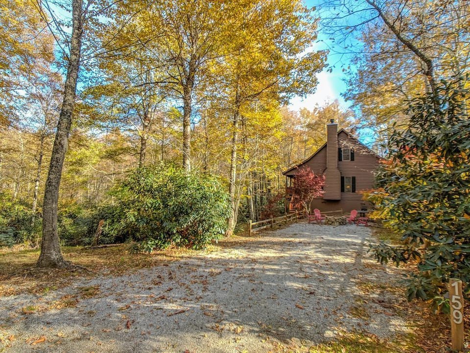 Treehouse Side Gravel Driveway / Fire Pit Area with Adirondack Chairs