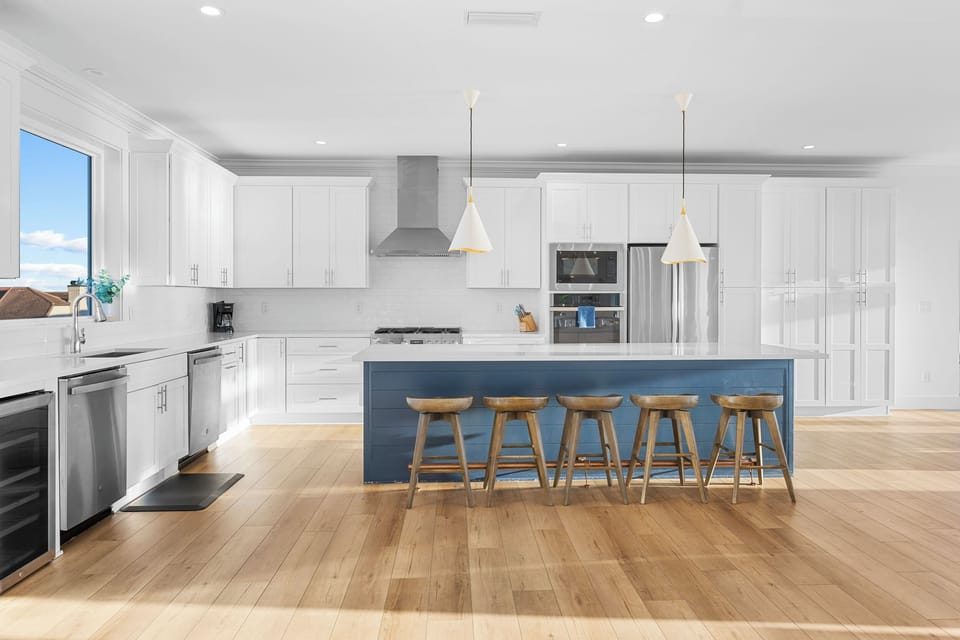 The kitchen features two dishwashers, two ovens and two refrigerators.