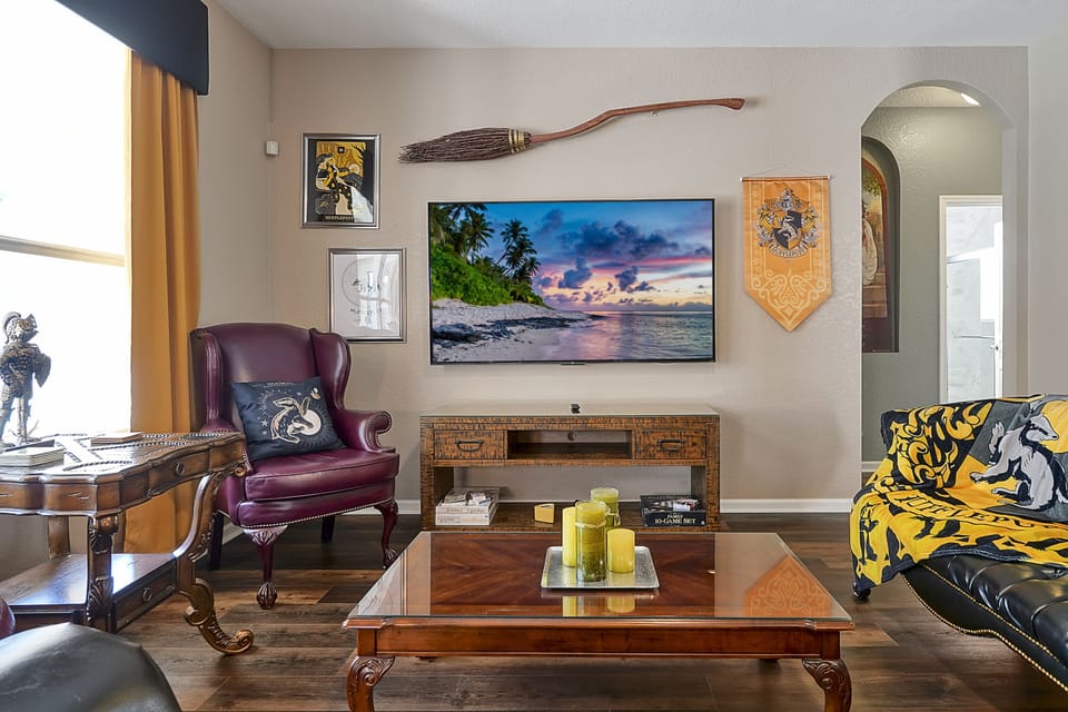 Welcome to Hogwarts! Our Hufflepuff Commons is the perfect place to hangout. It features a 75" smart TV and a custom made Nimbus 2000.
