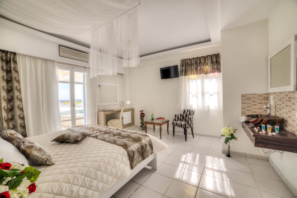 Junior Suite, Sea View | In-room safe, blackout drapes, soundproofing, iron/ironing board