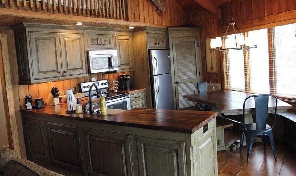 Fully remodeled kitchen with custom cabinets and a custom dining table for 8. 