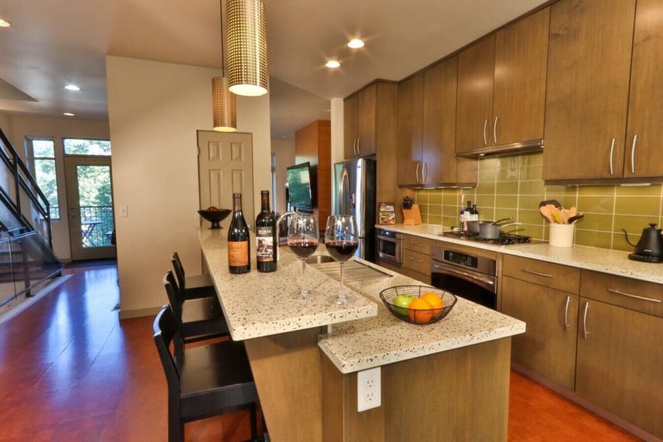 2nd floor Kitchen with stainless steel dishwasher, oven, stove, and refrigerator