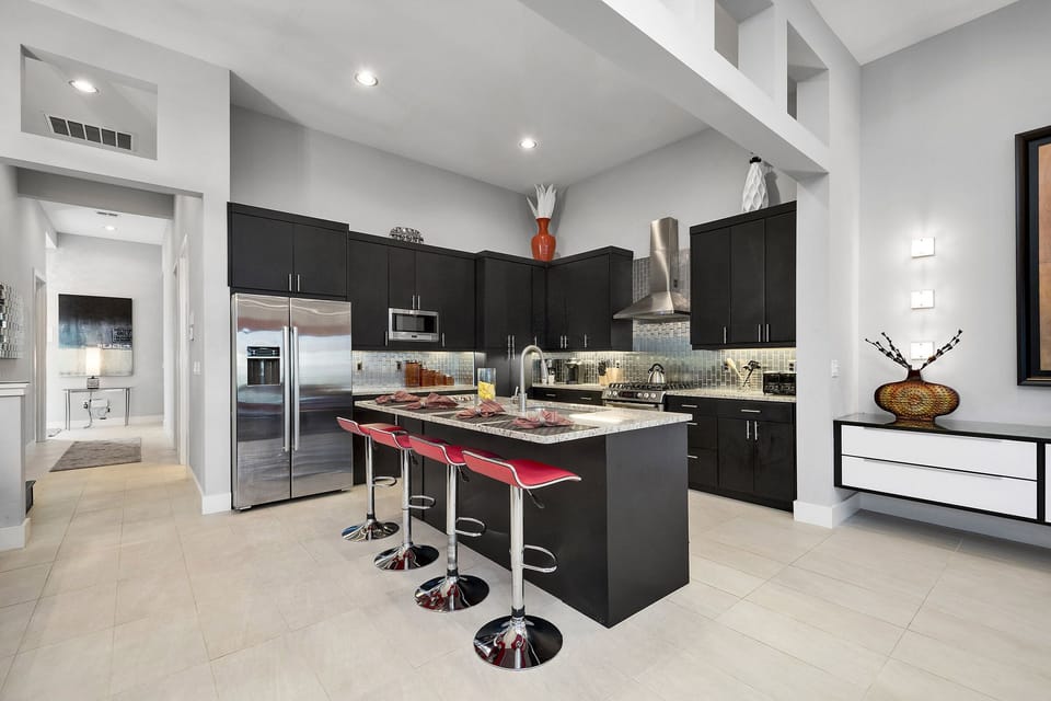 The spacious kitchen features stainless steel appliances