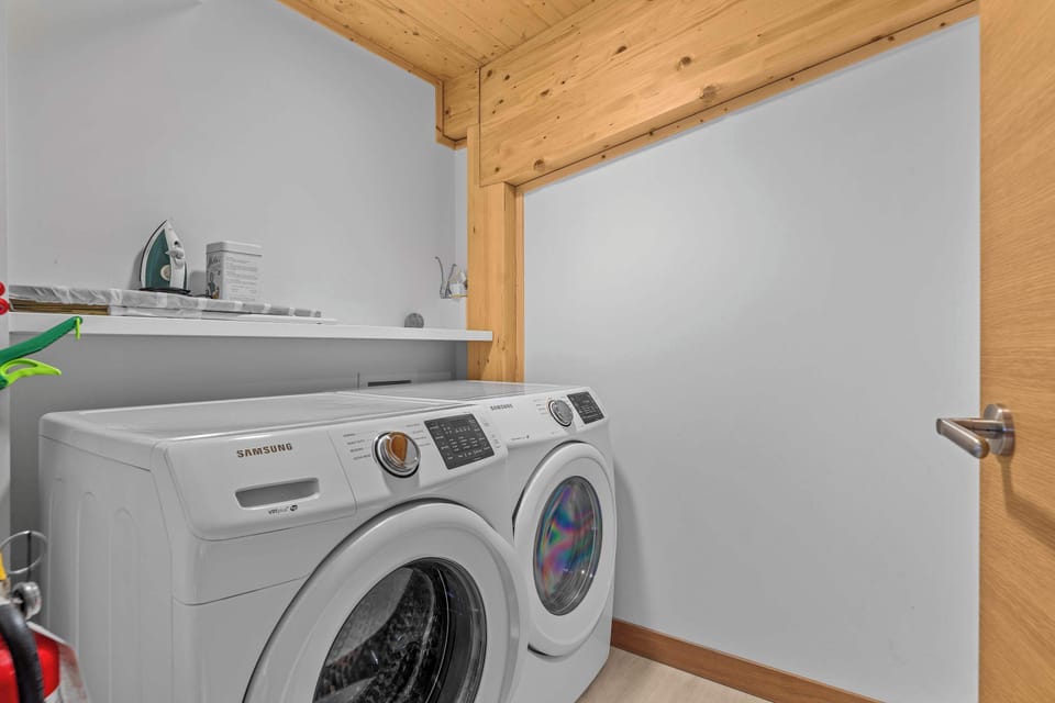 Washer and dryer, with complimentary environmentally friendly laundry detergent sheets supplied. Iron and ironing board also supplied