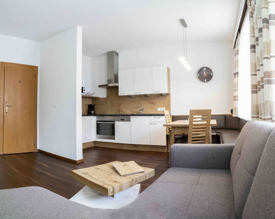 Deluxe Apartment, 2 Bedrooms, Mountainside | Living area | 49-cm flat-screen TV with cable channels, TV