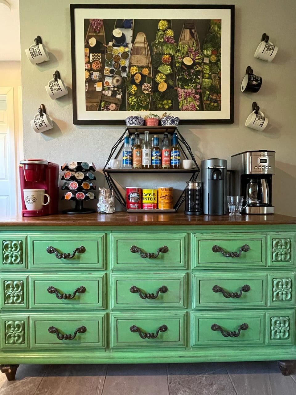 Drip-pot, Keurig, & a Nespresso machine along with assorted syrups and creamers.