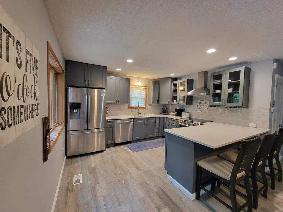 All stainless steel appliance plus plenty of spices available for cooking 