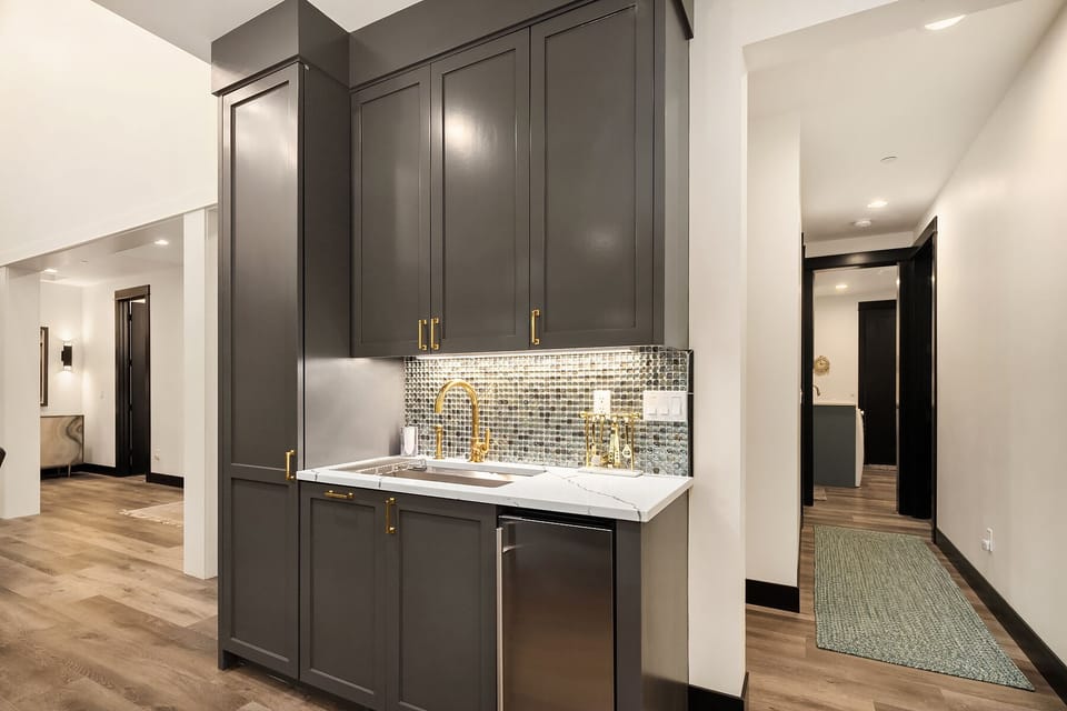 Fully stocked bar off the dining room in between kitchen and great room.