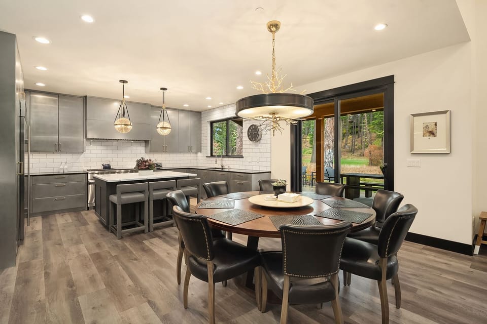 Main floor dining and kitchen with easy access to patio thru 2 sets of sliders.