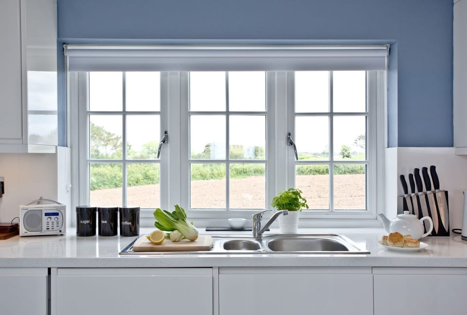 Garden view from kitchen, oven, hob, fridge/freezer, dishwasher - Blue Bay