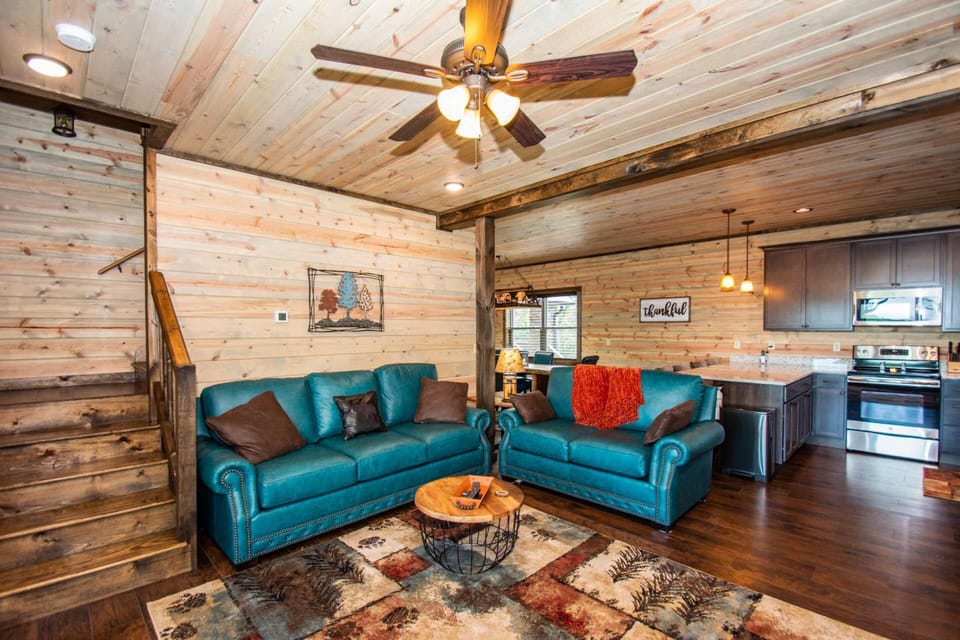 Open area living room with comfortable seating, or make your way upstairs to the extra bedroom or game room area.