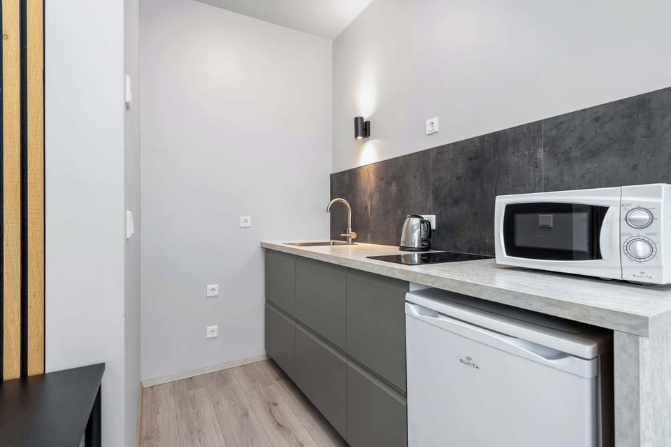 Kitchenette with microwave and stove