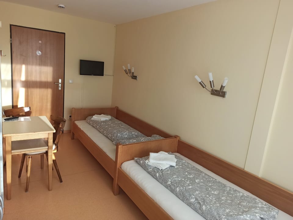 Twin Room, Shared Bathroom | Minibar, desk, blackout drapes, free WiFi