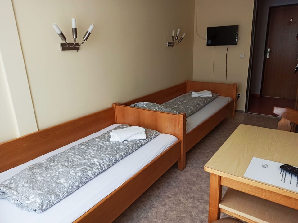 Twin Room, Shared Bathroom | Minibar, desk, blackout drapes, free WiFi