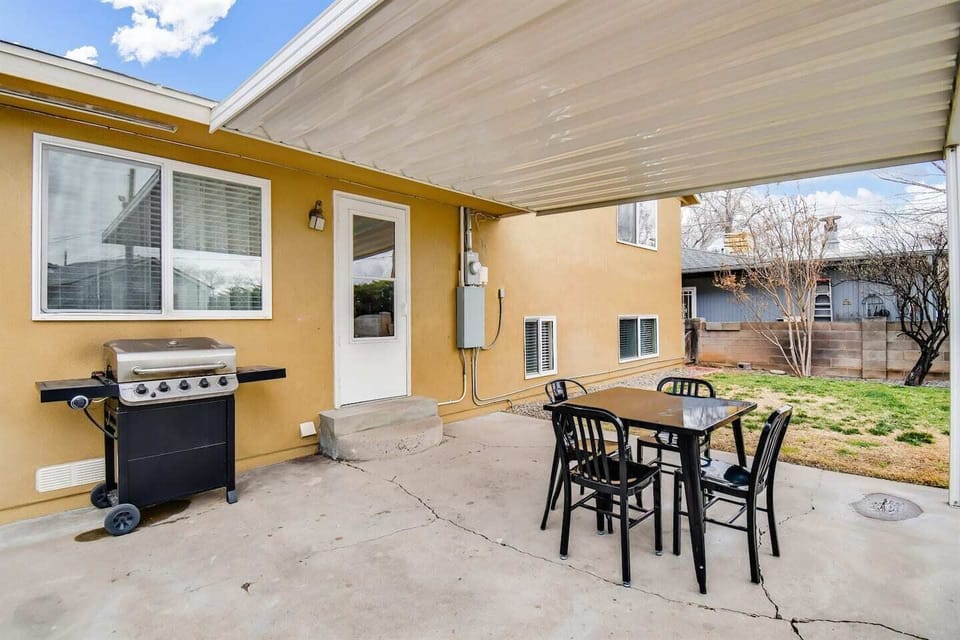 Backyard patio space with exterior seating and is fully fenced