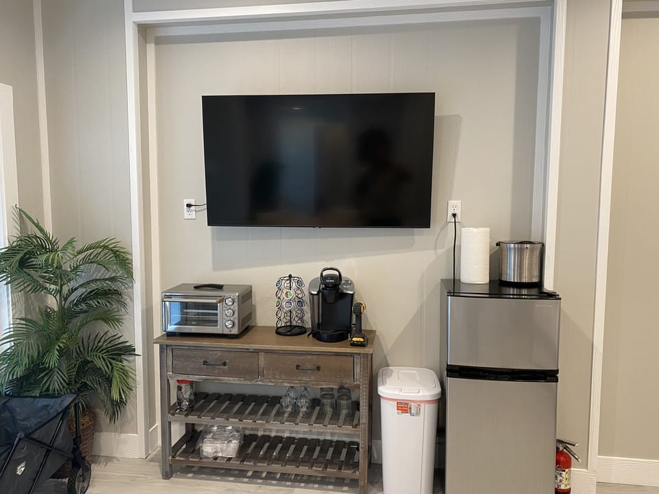 Downstairs/First Floor refrigerator, TV, oven, coffee machine, etc