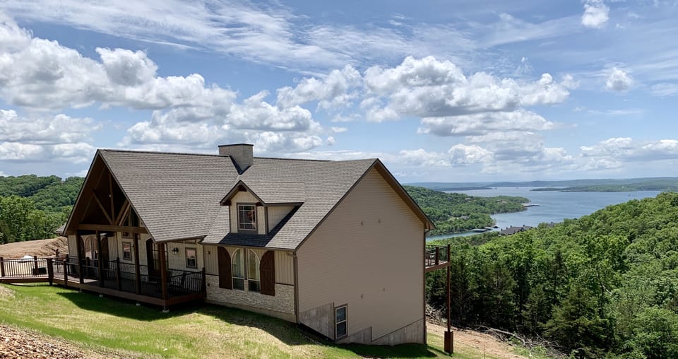House with Table Rock Lake behind it