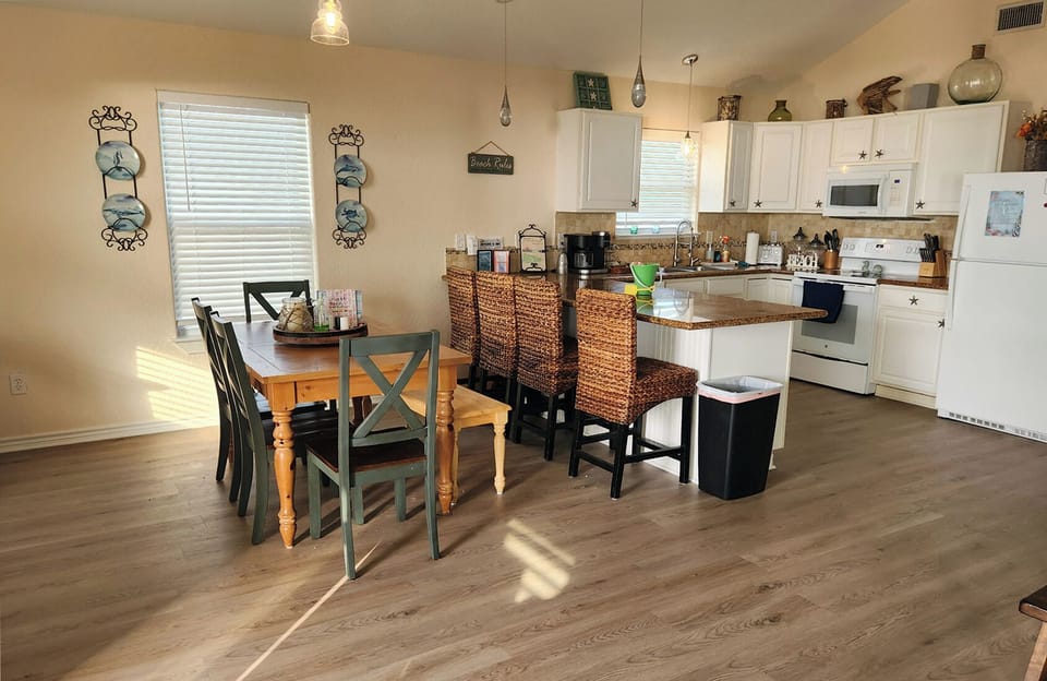 Dinning room and Kitchen with new flooring and paint.