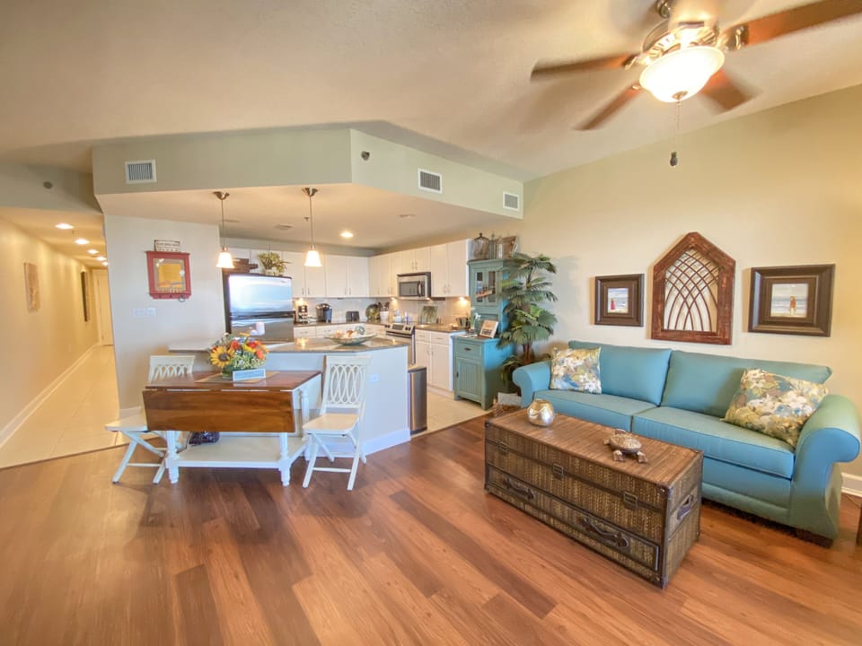 Living room, kitchen, & hallway to bedroom & bathrooms