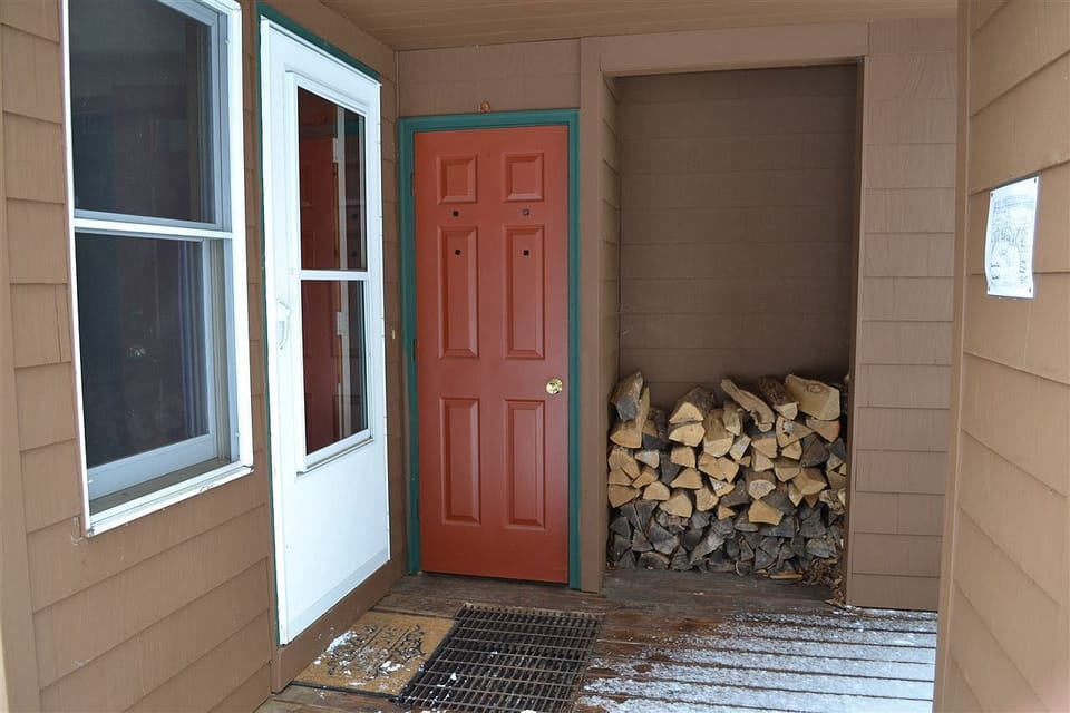 Front entrance with firewoods