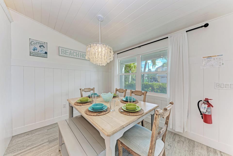 Gather around your bright dining space where coastal charm meets comfort. Natural light streams through while you share meals together.