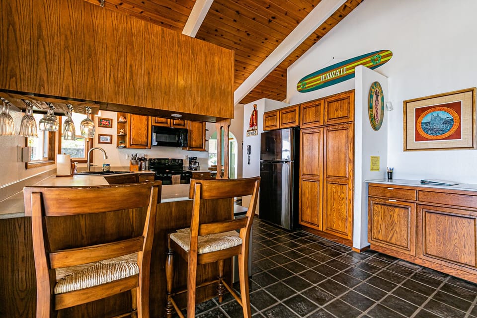 There's a breakfast bar next to the kitchen