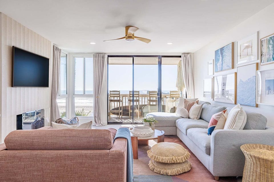 A thoughtfully furnished living area featuring elegant modern beach décor