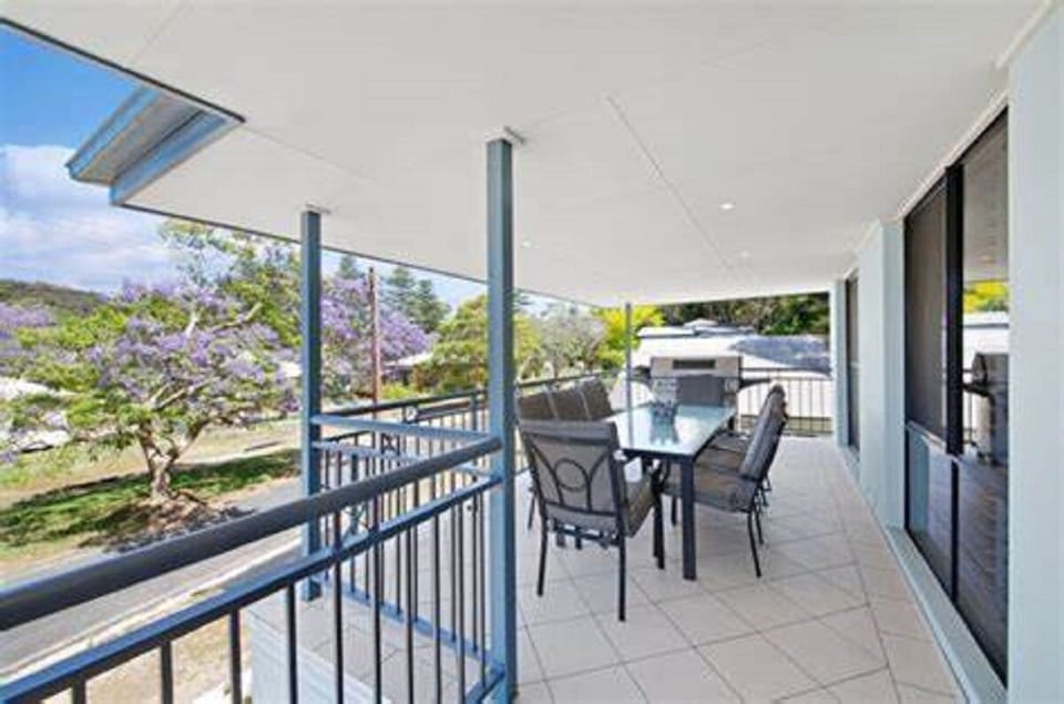 sunny large upstairs balcony with large BBQ and seating for 10 persons