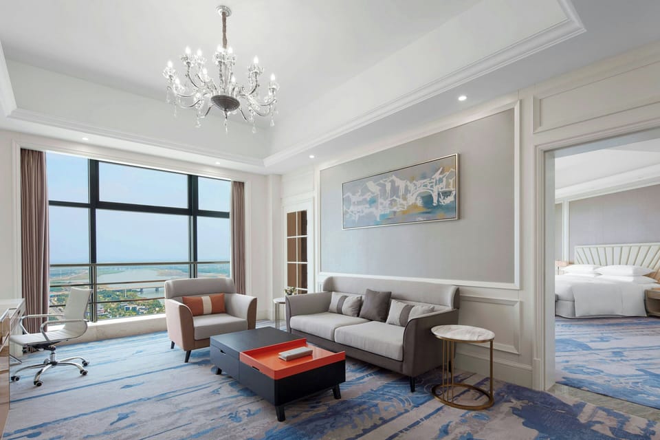 Executive Suite, 1 Bedroom | Living room | 55-inch flat-screen TV with satellite channels, TV