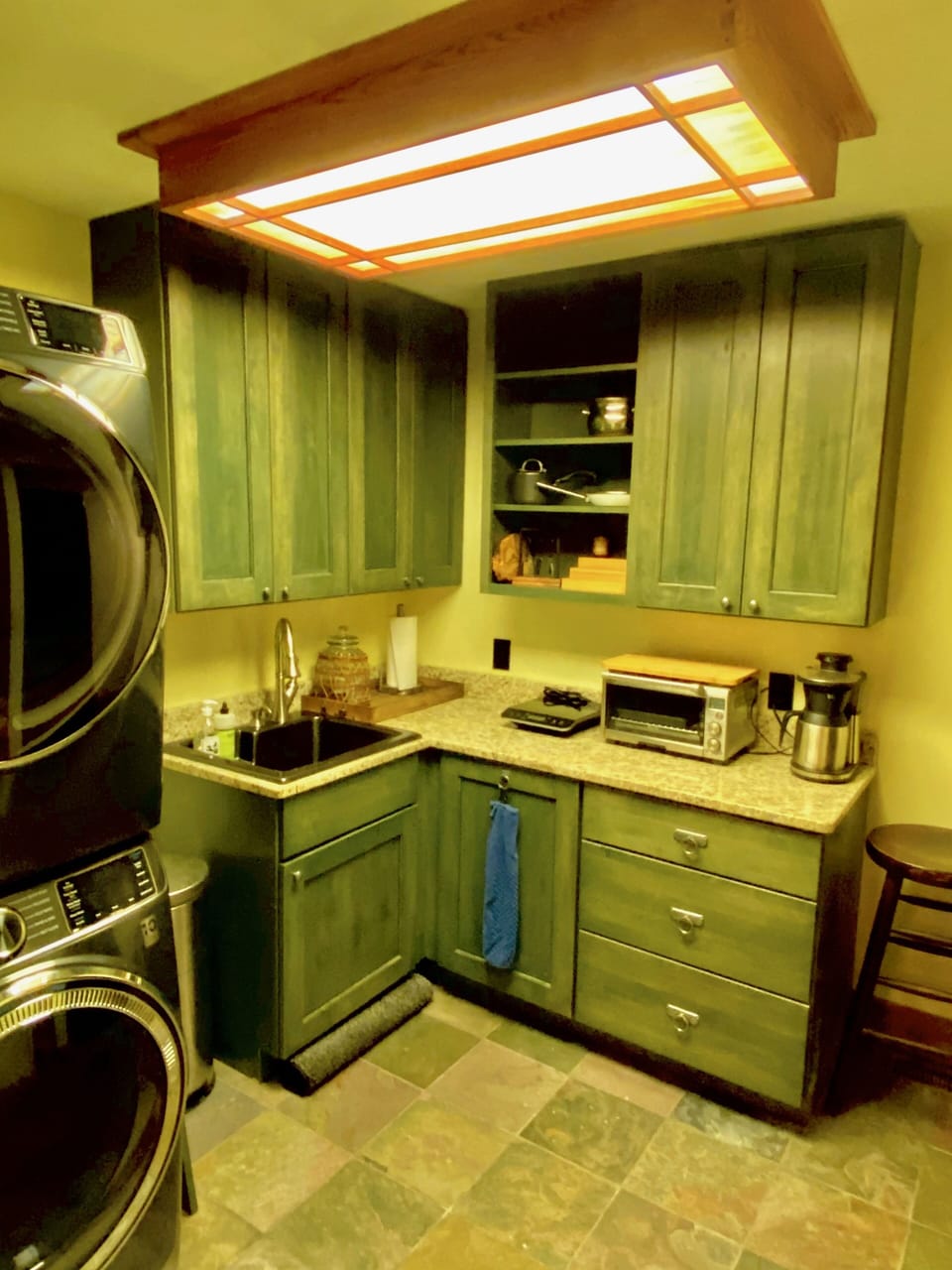 Laundry/kitchenette with as n extra refrigerator off theater room lower level.