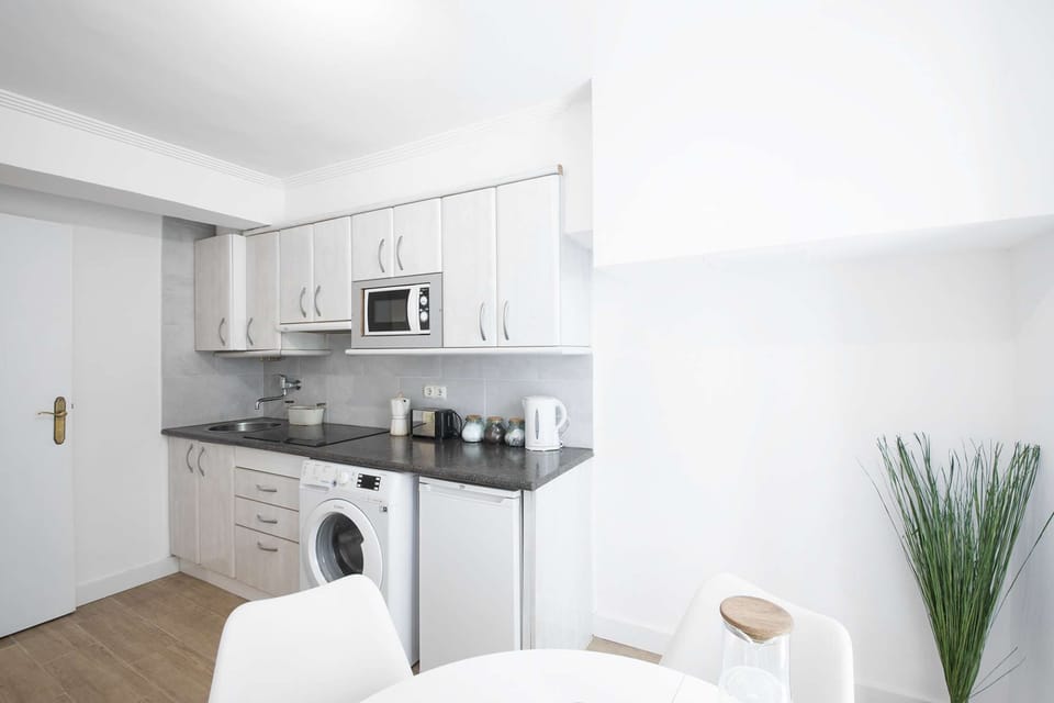 Kitchen and Dining Area with Balcony